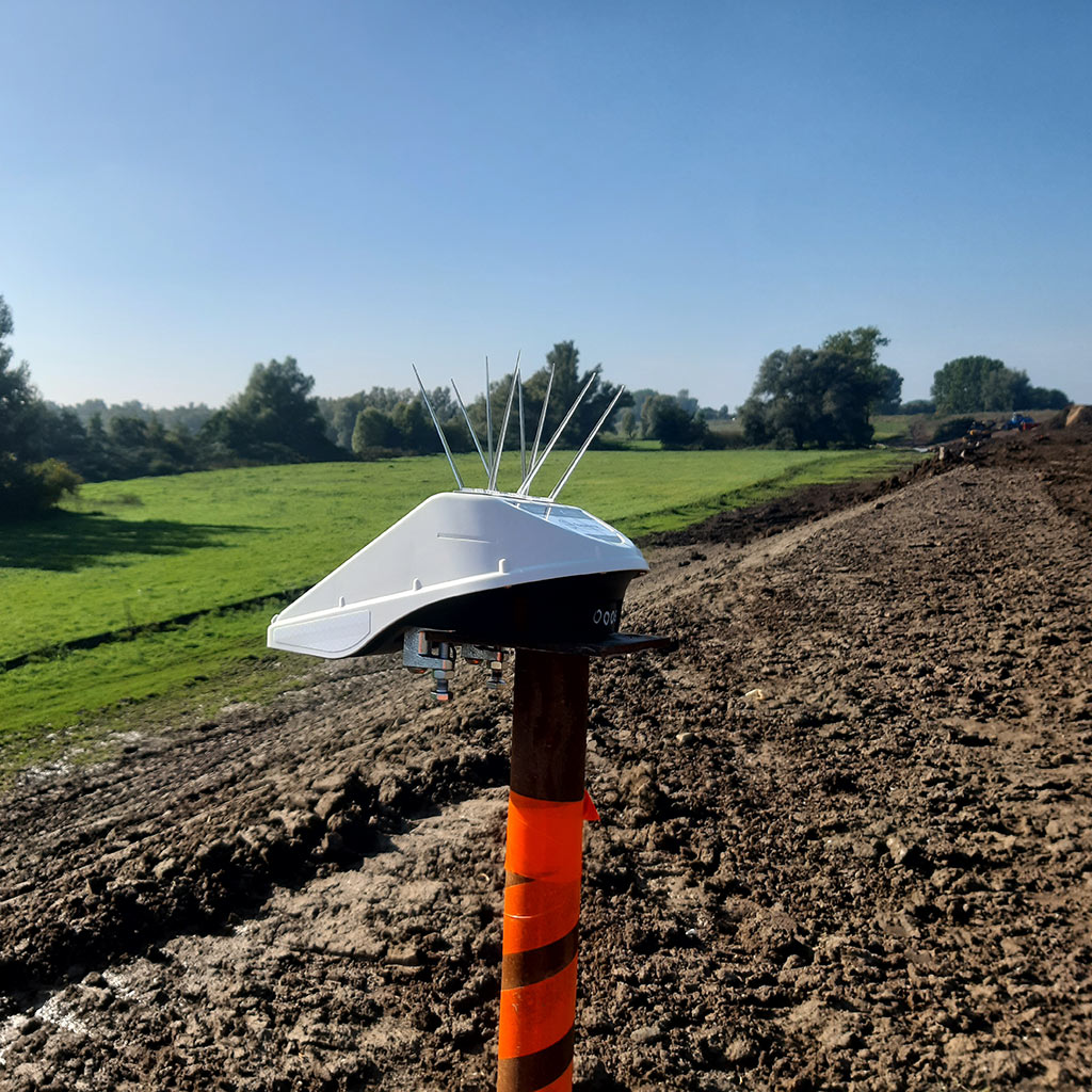 Locator Ones on the shores of Germany. Locator One, Basetime's autonomous measurement device, on a survey marker for precise soil settlement measurements