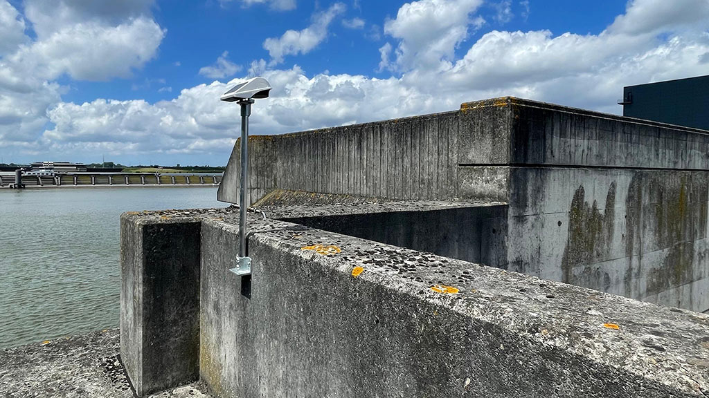 Locator Ones on the shores of Germany. Locator One, Basetime's autonomous measurement device, on a survey marker for precise soil settlement measurements