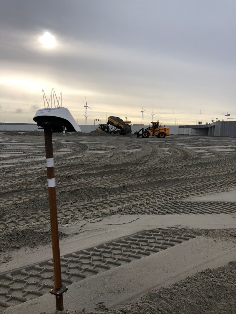 Locator Ones on the shores of Germany. Locator One, Basetime's autonomous measurement device, on a survey marker for precise soil settlement measurements