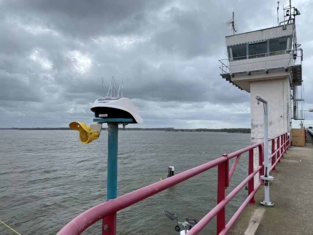 Locator Ones on the shores of Germany. Locator One, Basetime's autonomous measurement device, on a survey marker for precise soil settlement measurements